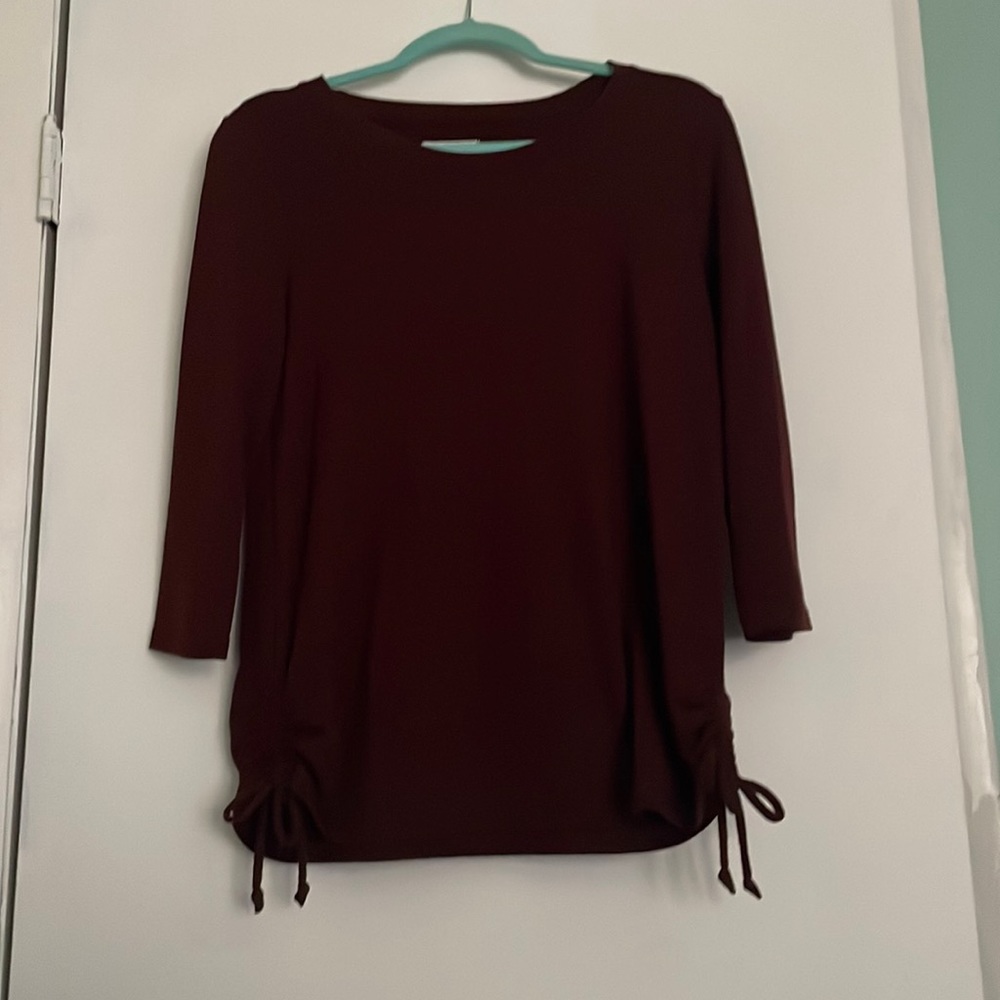 3/4 length sleeve top. Tied sides for a more formal look. Only worn once.